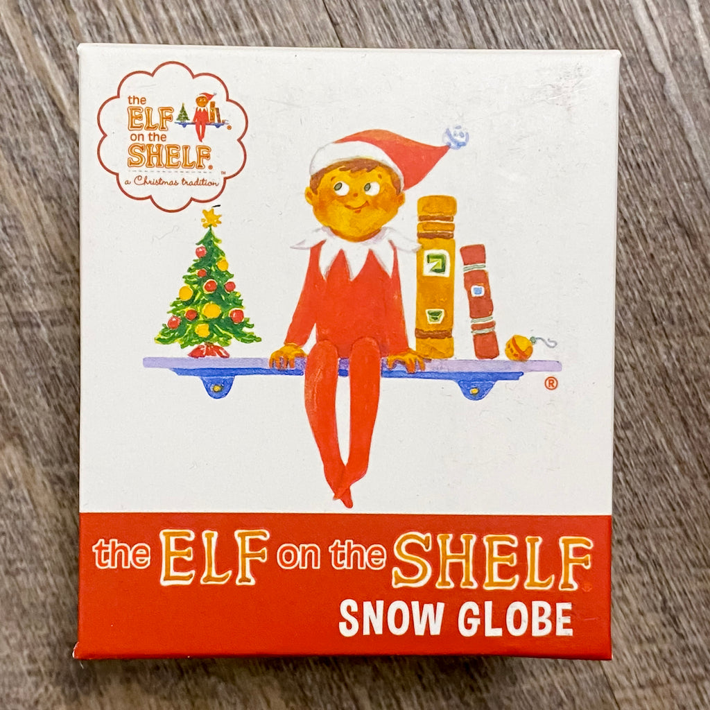 The Elf on the Shelf Snow Globe - Lyla's: Clothing, Decor & More - Plano Boutique