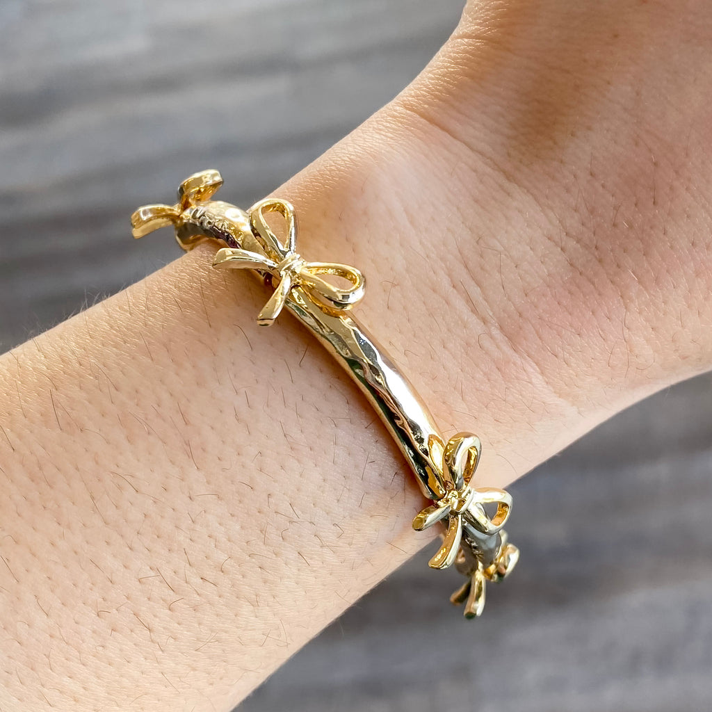 Bow Gold Bracelet by Meghan Browne - Lyla's: Clothing, Decor & More - Plano Boutique